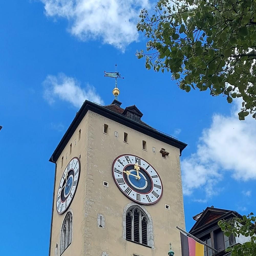 A clock tower with two clock faces. Landmark: St. Martin's Church.
